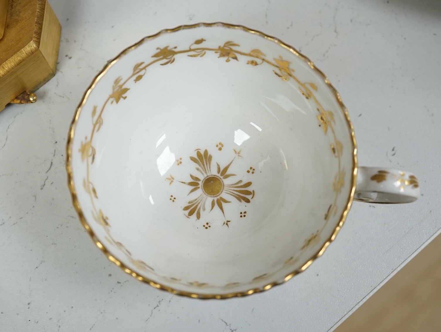 A Coalport floral part teaset, c.1825, to include teapot, sandwich plates and cups & saucers. Condition - poor to fair